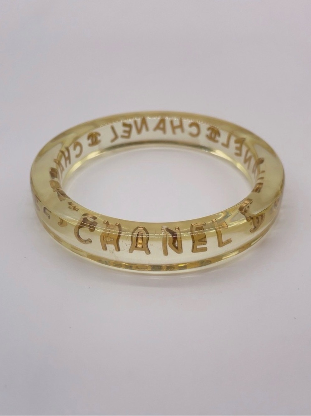 CHANEL LUCITE & Gold Letter Clear Acrylic Bangle - Picture 9 of 12